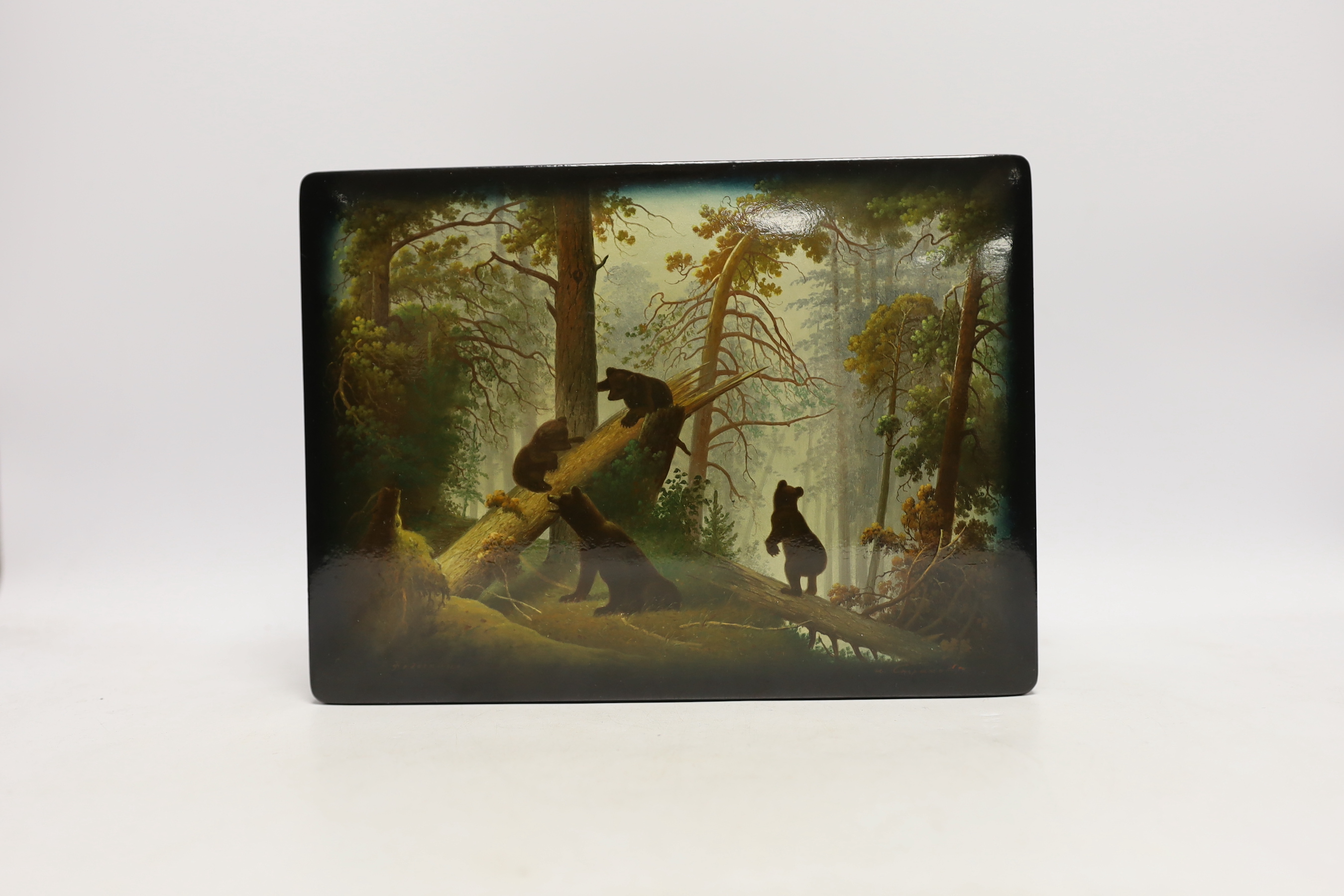 A Russian lacquer rectangular box, by Fedoskino, painted with the scene ‘Morning in the wood’ , based on the original painting by Shishkin, 25.5 cm wide, Please note this lot attracts an additional import tax of 5% on th